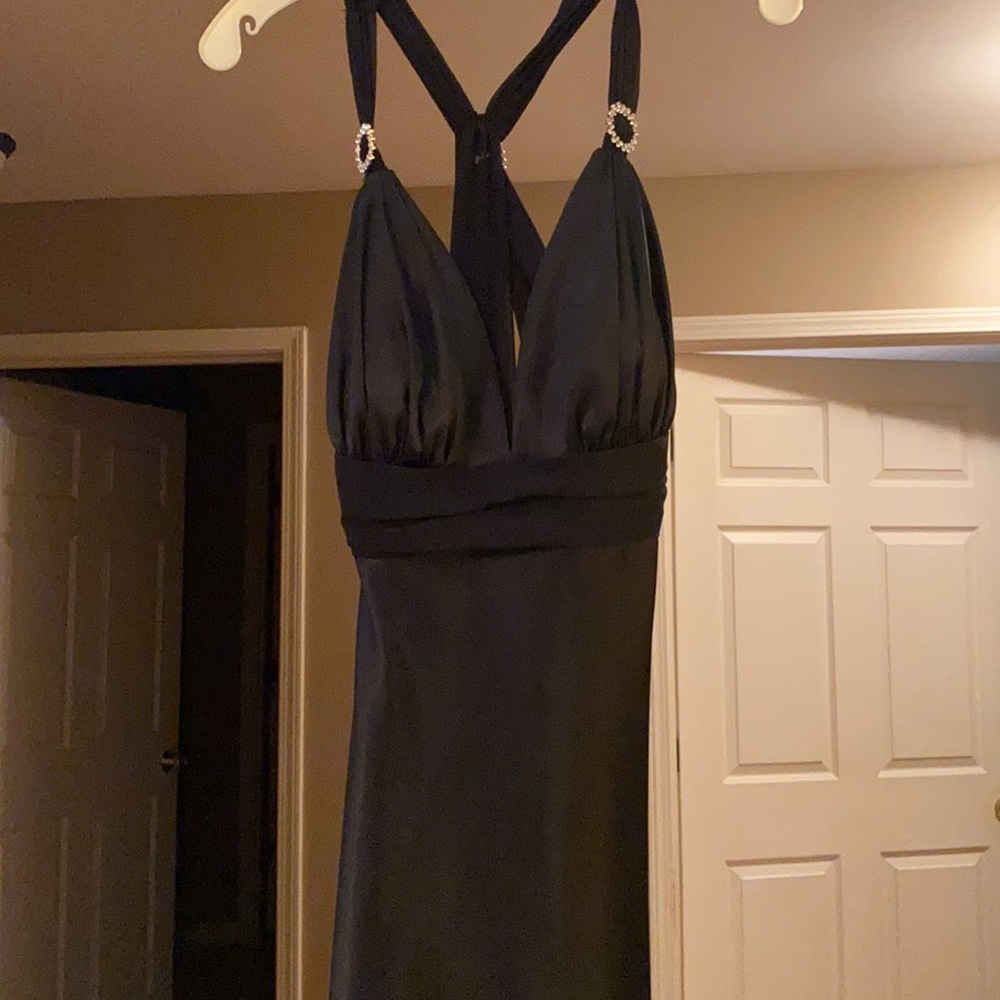 NEW W/ tags beautiful black silk evening gown with open back and tie. Size 8